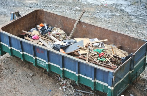 Residents arranging furniture for disposal in Hampstead